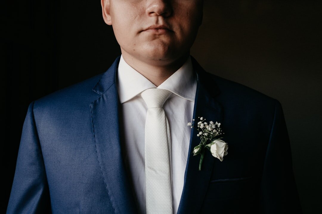 Studio portrait of a man in a navy suit jacket